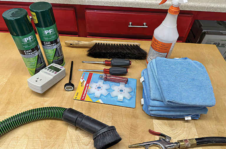 Technician testing RV thermostat wiring and connections